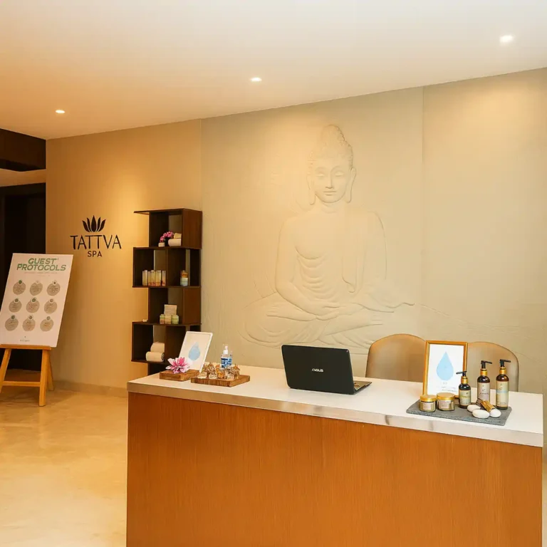 Reception area at Tattva Wellness Spa, Nagavara, Hebbal, Bengaluru, featuring a serene Buddha wall design and elegant spa interiors.