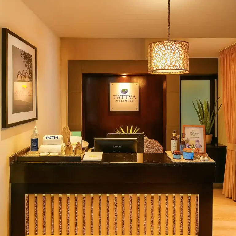 Reception area at Tattva Wellness Spa – 12th Main, Koramangala, Bengaluru, designed with warm lighting and elegant interiors to welcome guests for a rejuvenating spa experience.