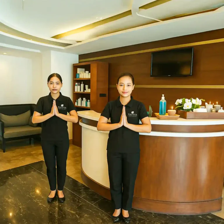 Spa therapists welcoming guests at the reception of Tattva Wellness Spa, Novotel Business Park, Bellandur, Bengaluru, with a warm Namaste greeting.
