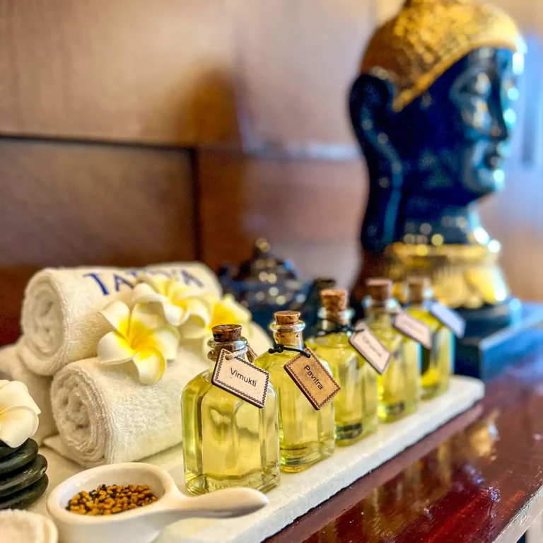 Various spa oils, fresh towels, and wellness essentials at Tattva Wellness Spa – 12th Main, Koramangala, Bengaluru, offering a holistic spa experience.