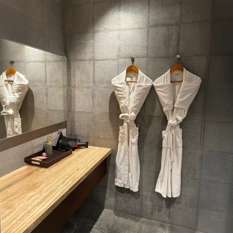 Neatly arranged spa robes and vanity area at Tattva Wellness Spa, providing guests with comfort, hygiene, and a premium wellness experience.