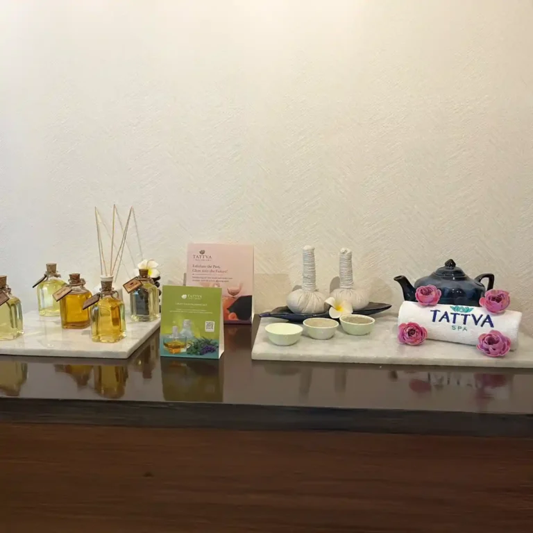 Aromatherapy essential oils, herbal compresses, and wellness tea setup at Tattva Wellness Spa, Courtyard By Marriott, Gurugram.
