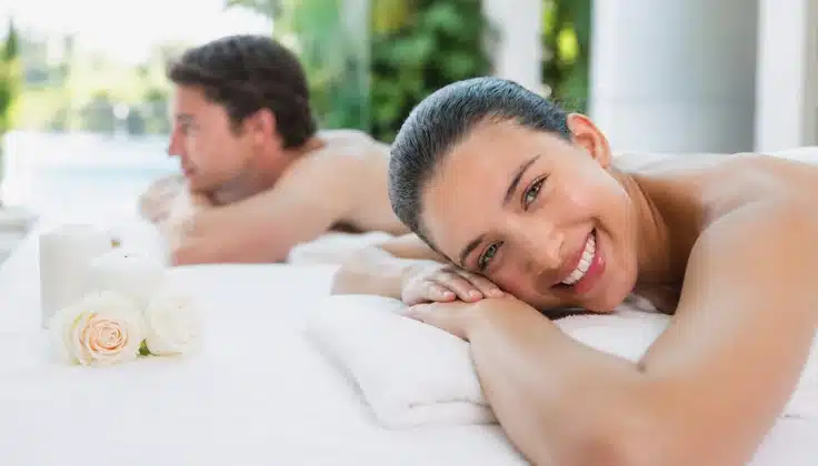 Couple relaxing together during a peaceful spa treatment.