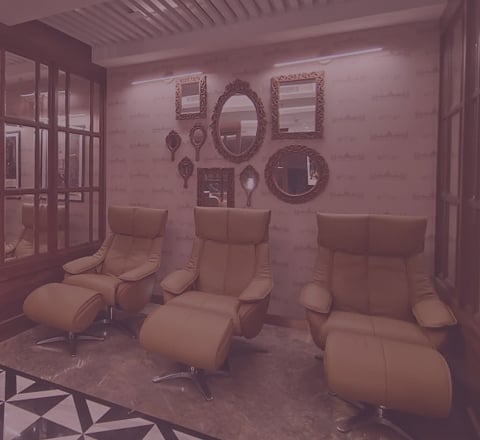 Tattva Spa foot reflexology lounge with comfortable recliner chairs, offering a soothing environment for relaxation and wellness therapies.
