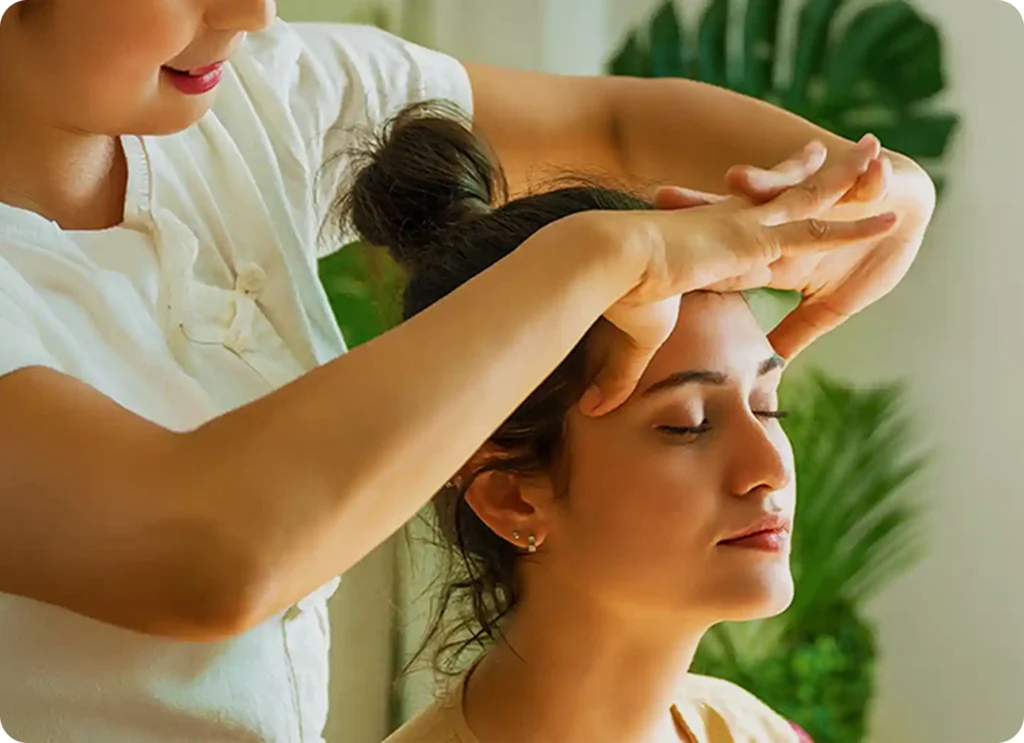 a woman getting a head massage 