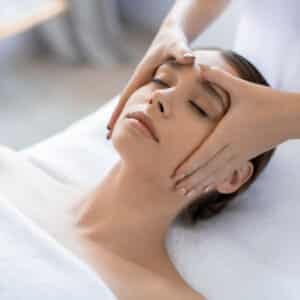 Young,Woman,Having,Anti-stress,Facial,Massage,In,Salon,At,Spa