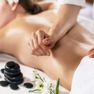 Young,Beautiful,Woman,Enjoying,Massage,On,The,Table,At,Spa
