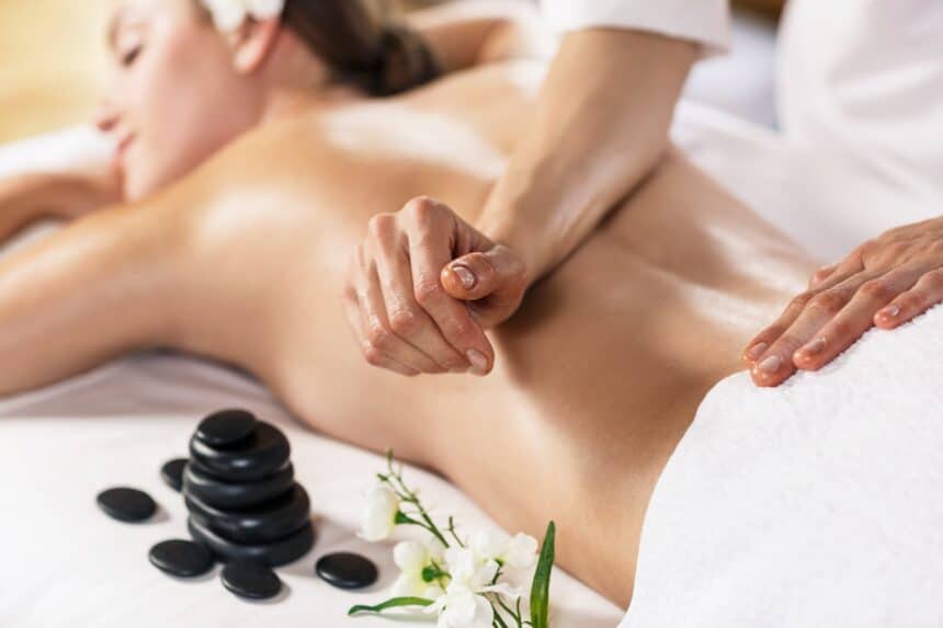 Young,Beautiful,Woman,Enjoying,Massage,On,The,Table,At,Spa