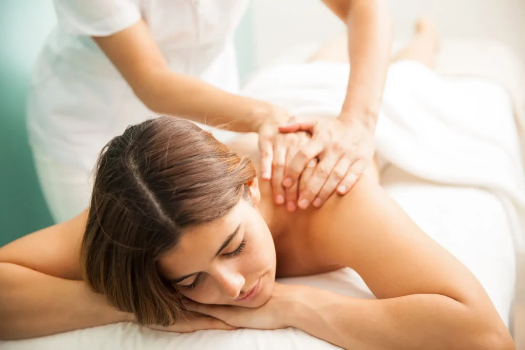 Spa therapist at Tattva Wellness Spa performing a stress-relieving back massage, focusing on spa benefits for office employees to relax and rejuvenate.