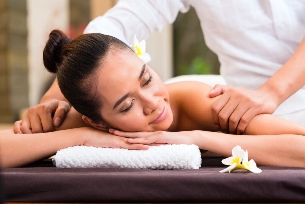 Guest enjoying a relaxing spa massage with Tattva Serenity Membership benefits.
