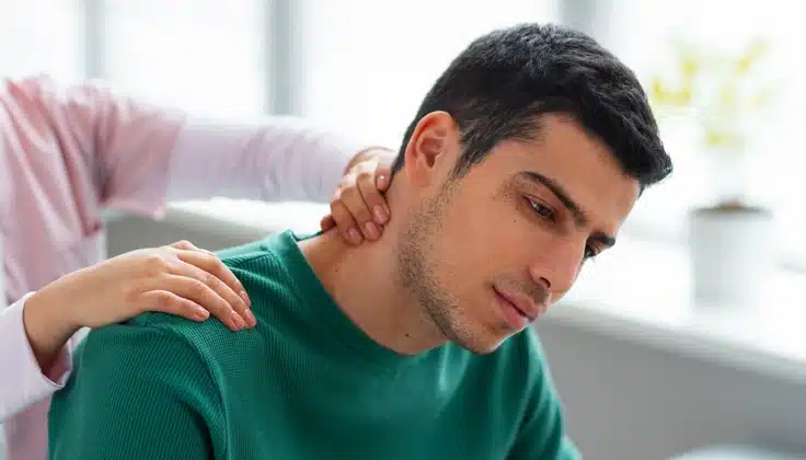 Man receiving gentle neck massage for cervical spondylosis discomfort.