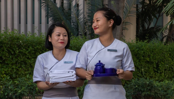 Tattva Spa therapists preparing fresh towels and welcome refreshments for Serenity Membership guests.