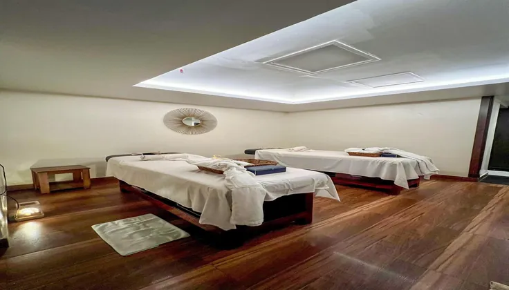 Premium and luxury couple spa room in Grand Mercure Koramangala Bangalore with wooden flooring.
