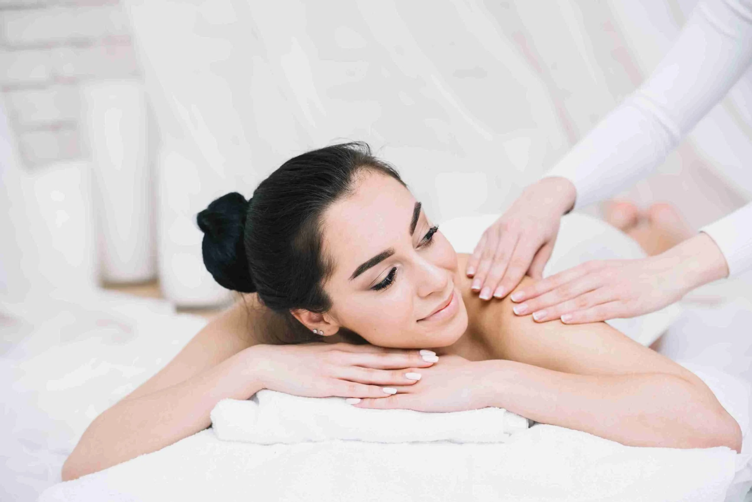 A girl lying on spa bed in tattva spa and enjoying best Swedish massage in Gurgaon.
