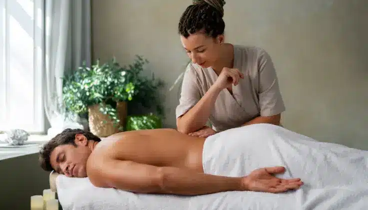 Customer receiving post-therapy care after a deep tissue massage at Tattva Spa in Noida, focusing on muscle recovery and relief from tension.