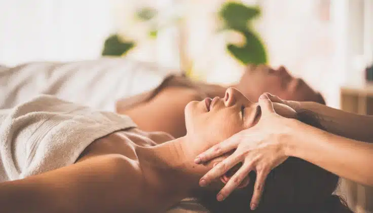 Couple enjoying Indian head massage together in a calm spa setting, promoting relaxation, scalp care, and overall wellness.