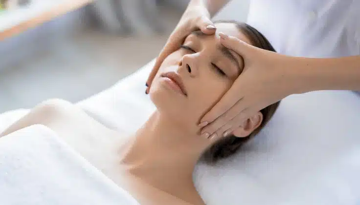 Woman receiving a relaxing facial treatment, highlighting how stress reduction can support healthier-looking skin.