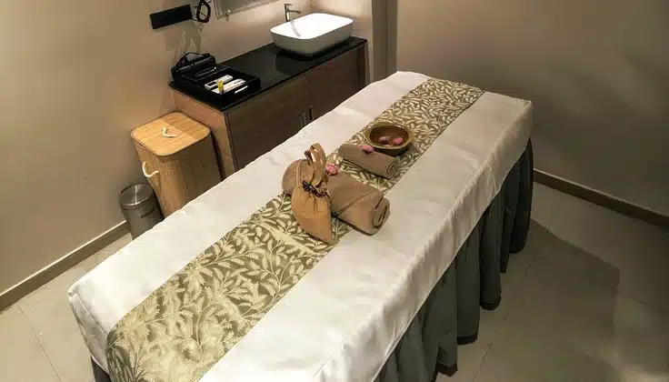 Elegant spa room at the best spa in Vijayawada, featuring a calming ambiance and wellness essentials for relaxation and rejuvenation at Tattva Spa.