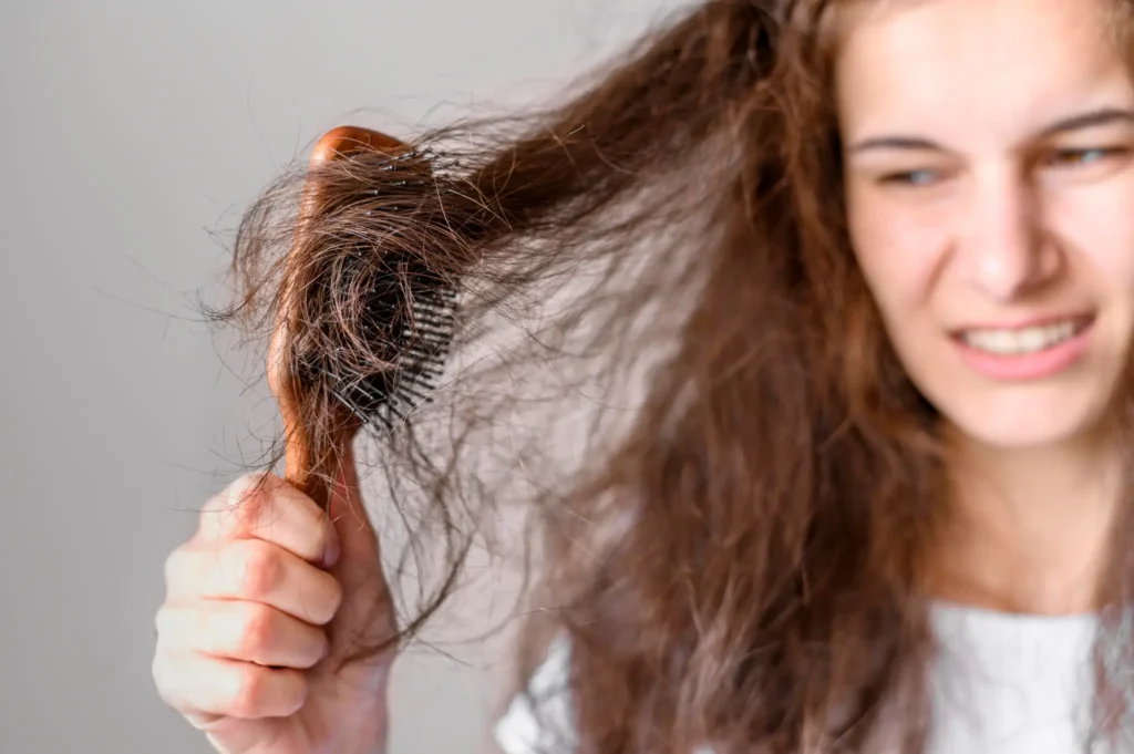 A girl with tangled, frizzy hair, highlighting common monsoon scalp and hair concerns.