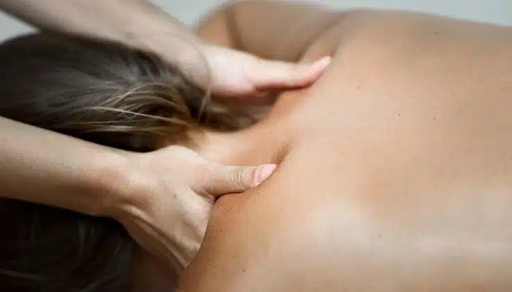 A woman guest receiving a Swedish massage during monsoon at Tattva Wellness Spa.
