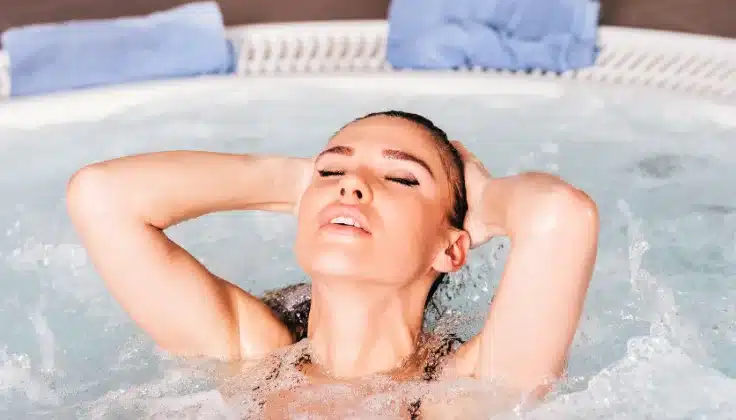 Guest enjoying a relaxing Jacuzzi spa experience for comfort and complete relaxation.