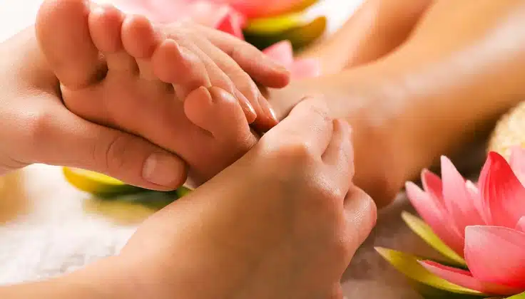 Guest receiving Foot Reflexology at Tattva Wellness Spa for tired feet and relaxation.