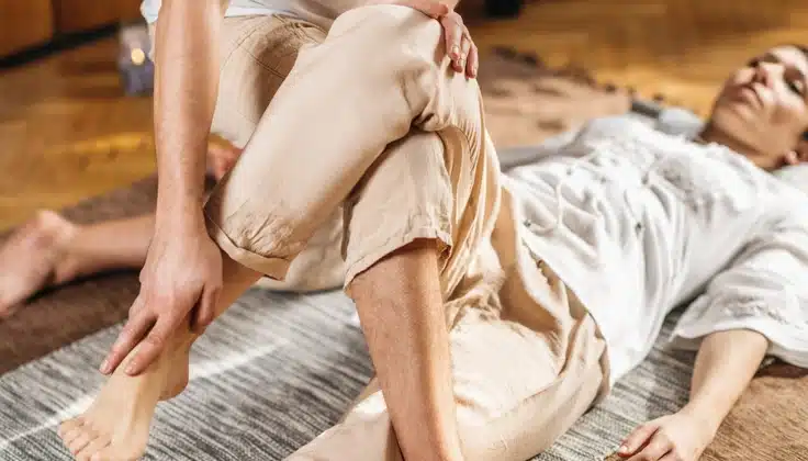 Assisted yoga stretch to improve flexibility, mobility, and relaxation.