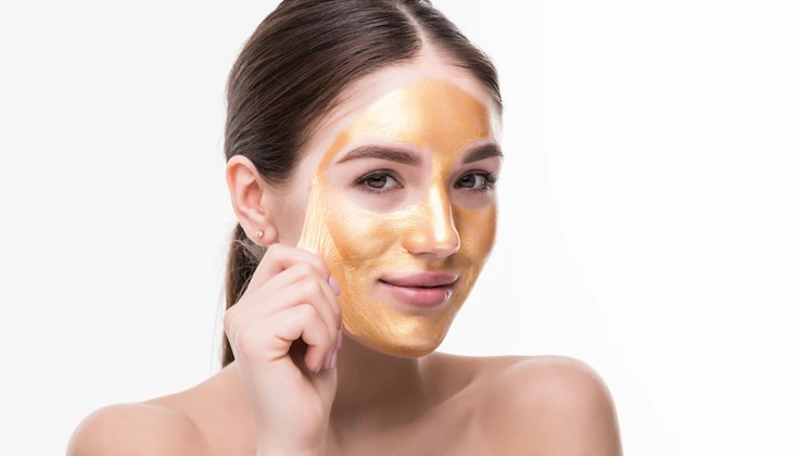 Illuminating face mask applied for brighter, radiant-looking skin.