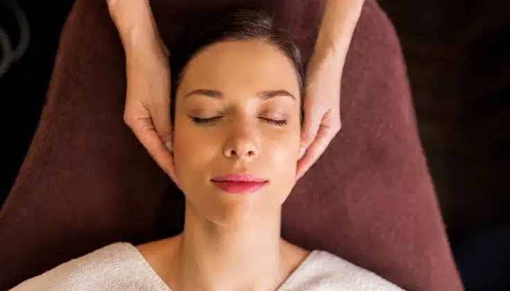 Guest receiving Lymphoglow Rejuvenation with gentle facial techniques for relaxation and a refreshed look.