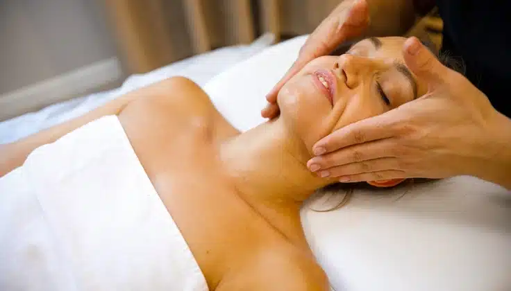 Guest receiving a Lymphatic Face Massage with gentle facial techniques at Tattva Wellness Spa.