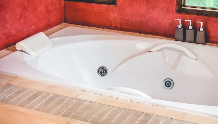 Jacuzzi bath with hydrotherapy jets for relaxing tired muscles.