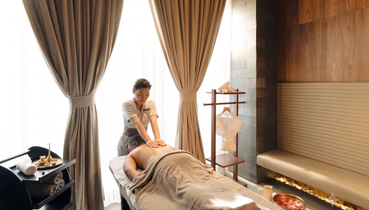 Guest receiving a relaxing cream-based massage at a wellness spa.