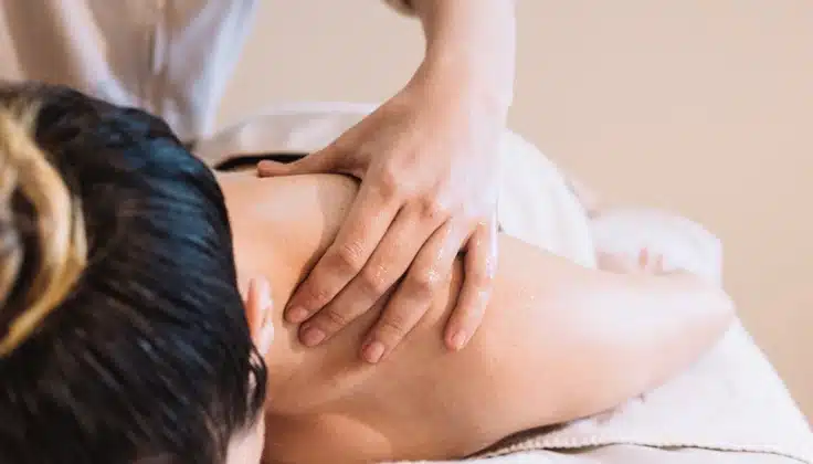 Guest receiving a relaxing Swedish massage with gentle flowing strokes.