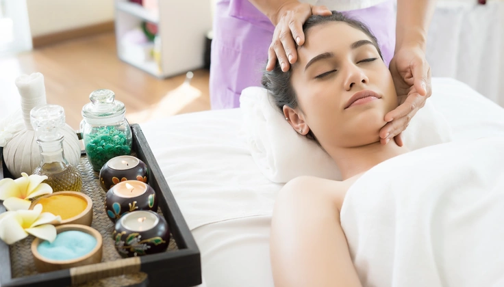 Woman enjoying a relaxing facial massage for healthy, refreshed skin.